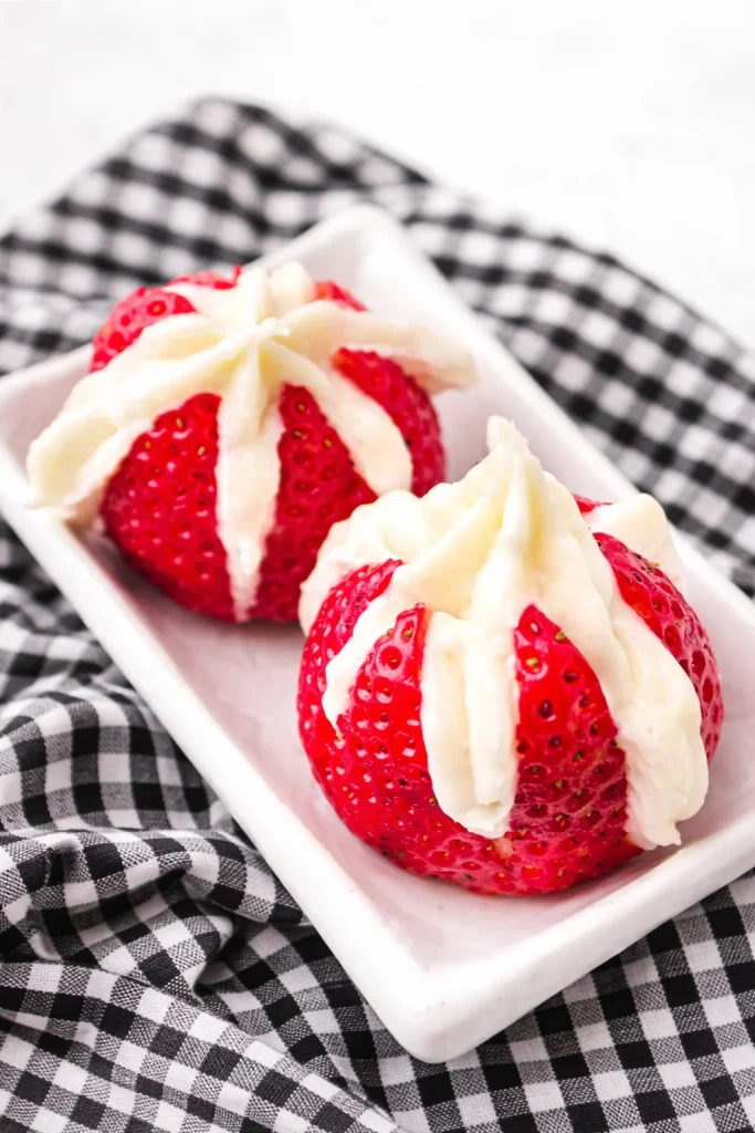 Delicious cheesecake stuffed strawberries ready to be enjoyed as a fresh dessert