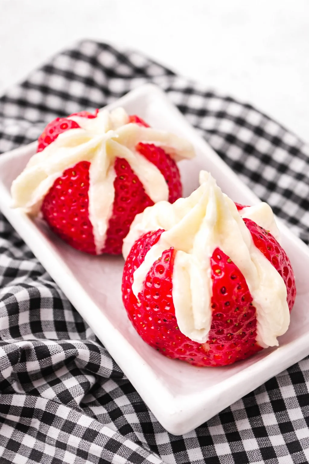 Delicious cheesecake stuffed strawberries ready to be enjoyed as a fresh dessert