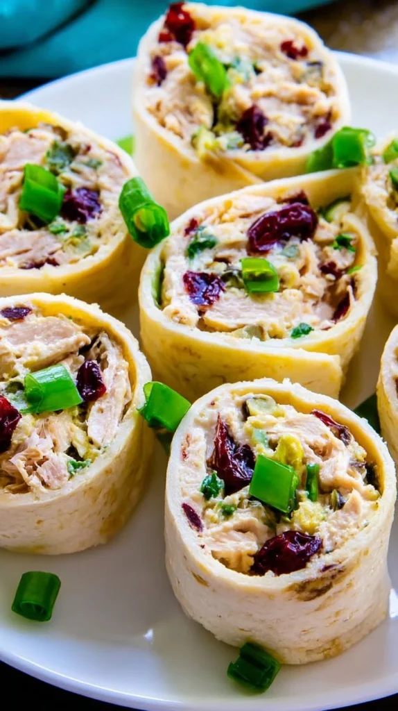 Chicken Cranberry Pinwheels appetizer with chicken and cranberry filling.