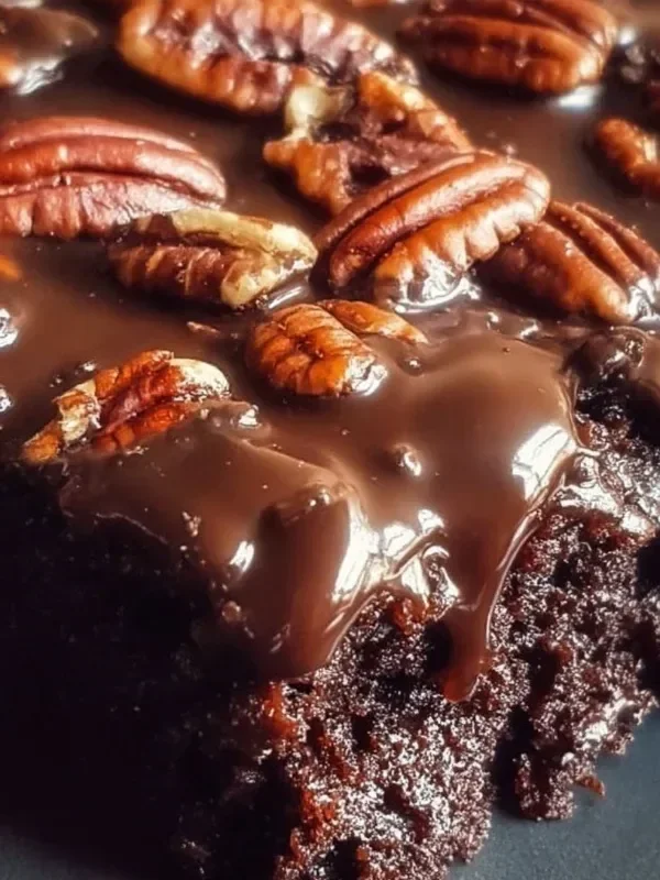 Delicious slice of Classic Texas Sheet Cake with chocolate frosting on a plate