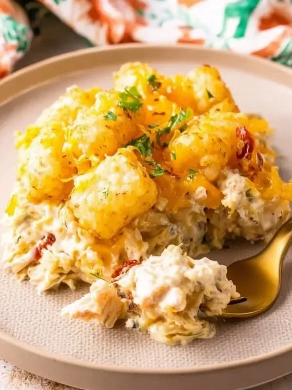 Delicious Cracked Out Chicken Tater Tot Casserole topped with melted cheese and crispy tots