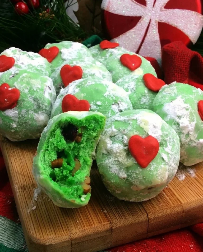 Delicious Grinch Snowball Cookies decorated for the holidays