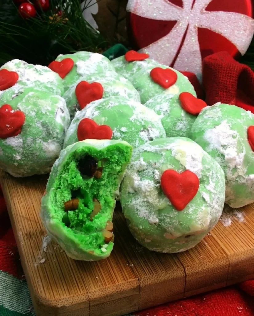 Delicious Grinch Snowball Cookies decorated for the holidays
