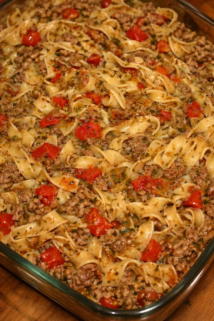 Plate of Italian Style Drunken Noodles garnished with fresh herbs and chilies