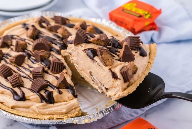 No Bake Reese's Peanut Butter Cup Pie topped with chocolate and peanut butter