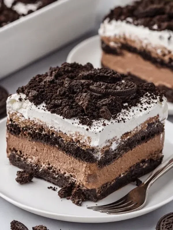 Decadent Oreo Lasagna dessert layered with cream and crushed Oreos