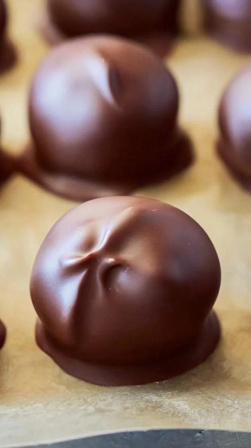 Delicious homemade peanut butter balls on a wooden table