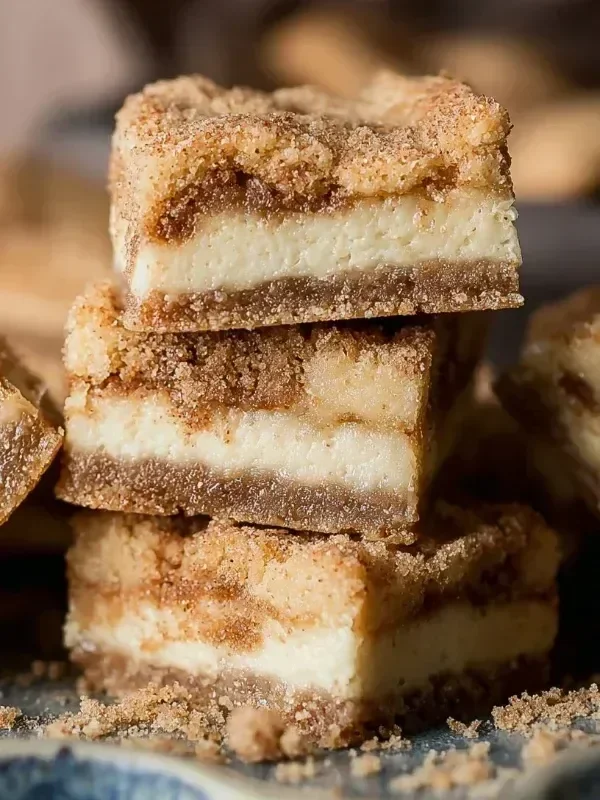 Snickerdoodle Cheesecake Bars with a cinnamon sugar topping