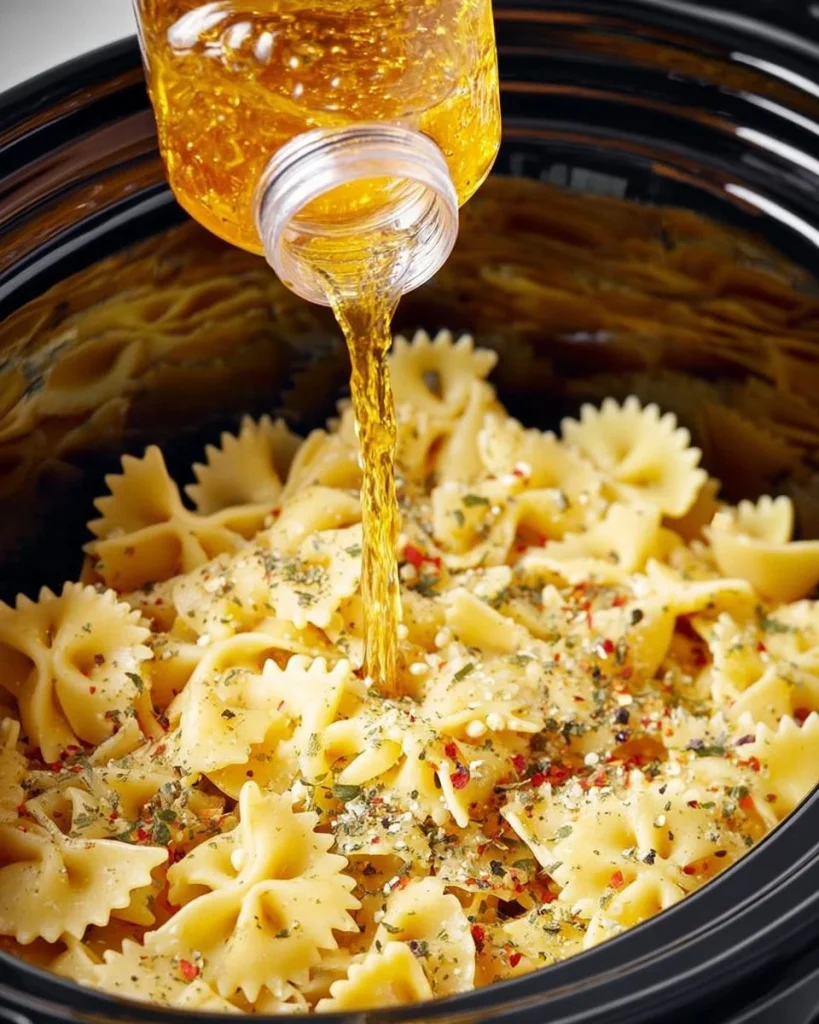 Delicious slow cooker Italian tomato pasta with fresh ingredients.