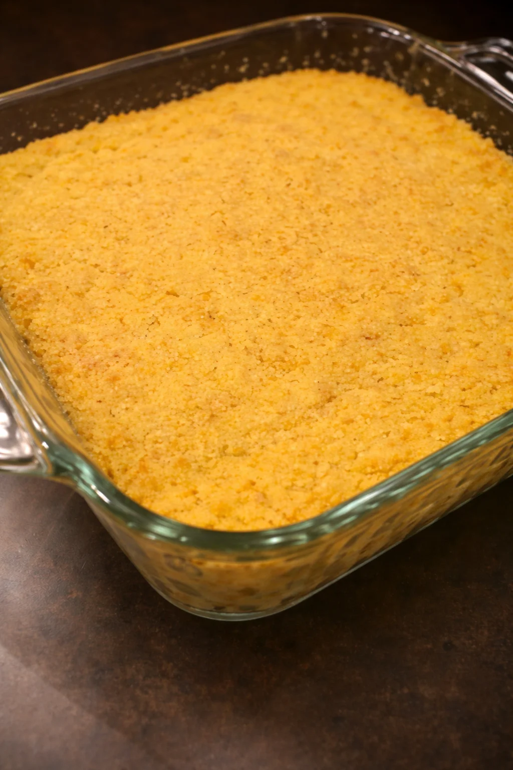 Delicious Mexican side dish featuring corn and bread on a plate.