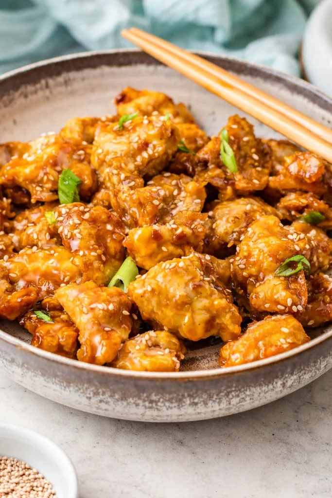 Crispy Air Fryer General Tso's Chicken served with stir-fried vegetables