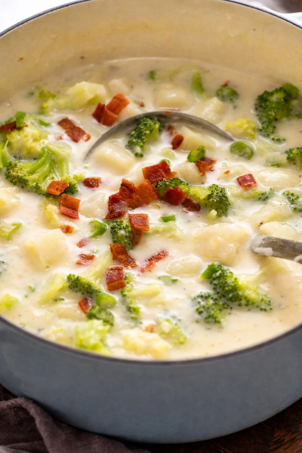 Delicious Broccoli Potato Soup served in a bowl with fresh herbs