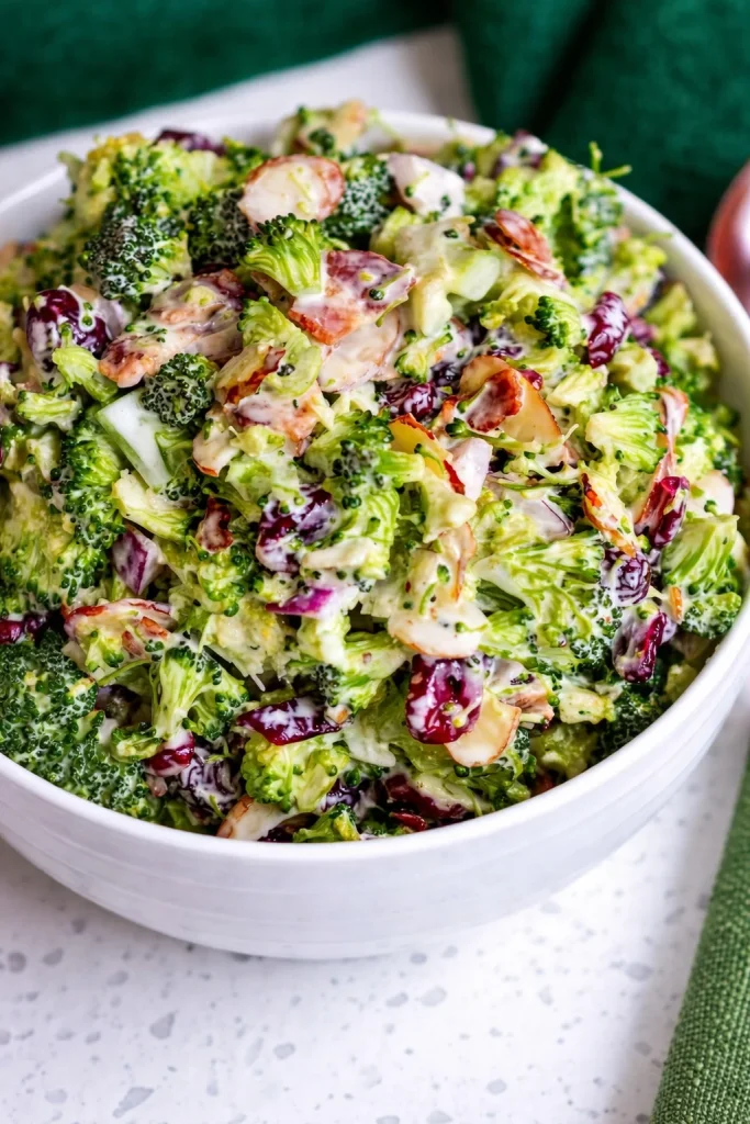 Fresh and colorful broccoli salad with vegetables and dressing