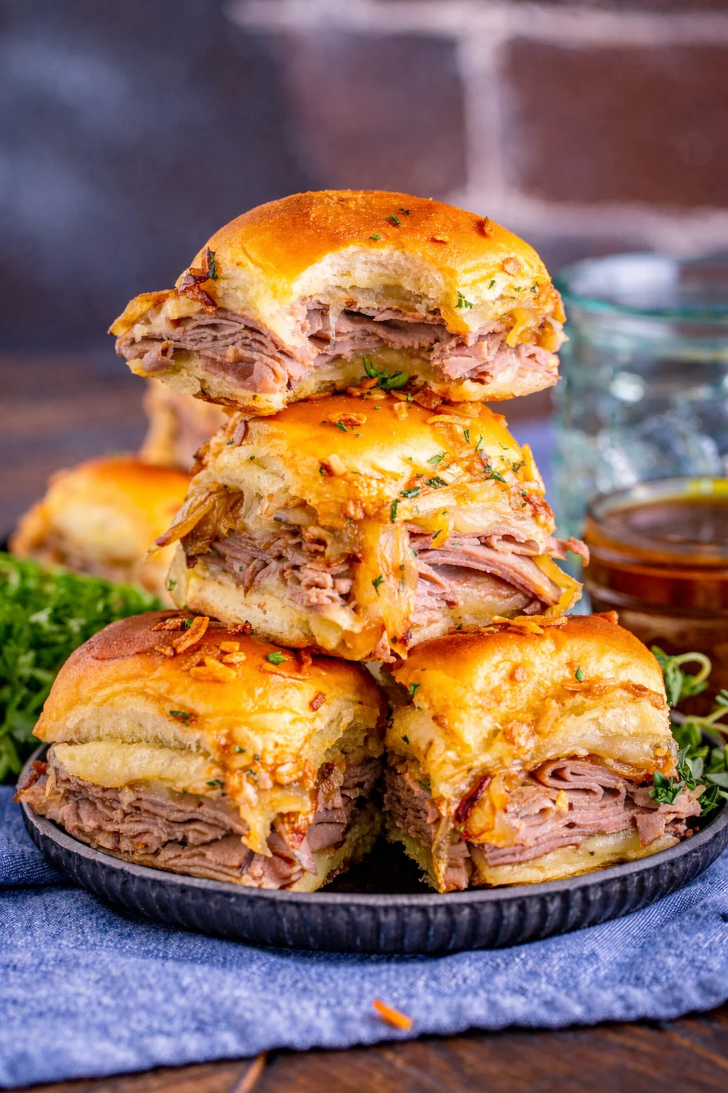 Delicious French Dip Sliders served with au jus for dipping