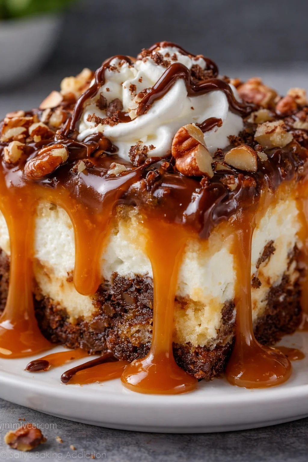 Delicious gooey caramel turtle poke cake topped with caramel and pecans.