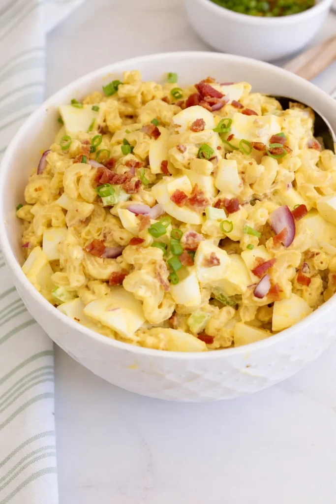 Learn how to make this delicious and unique deviled egg pasta salad, which combines the flavors of deviled eggs, bacon, and pasta into one tasty salad.