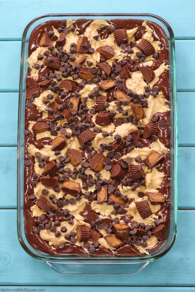 Deliciously gooey Peanut Butter Earthquake Cake topped with chocolate and peanut butter.