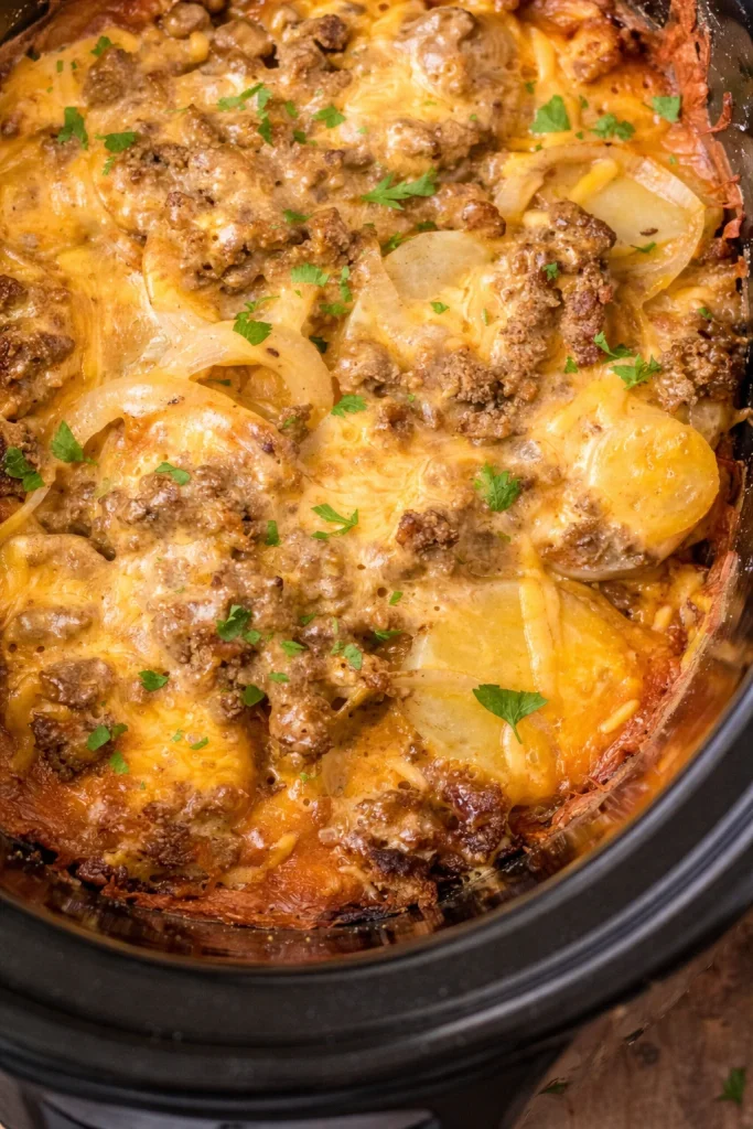 Slow Cooker Beef and Potato Au Gratin with cheese and creamy layers