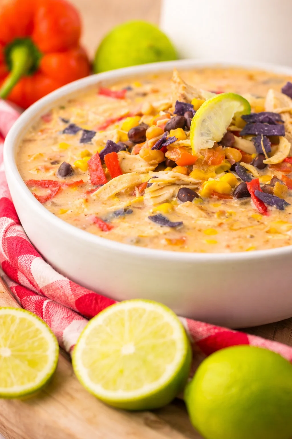 Bowl of slow cooker Chick-Fil-A Tortilla Soup garnished with cilantro and lime
