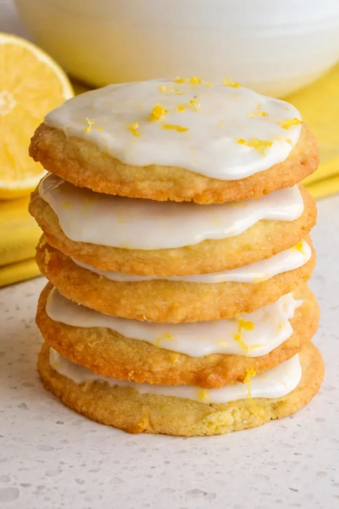 These delectable Iced Lemon Cookies are soft on the inside with slightly chewy, crispy edges, all topped with a four-ingredient light sweet lemon glaze.