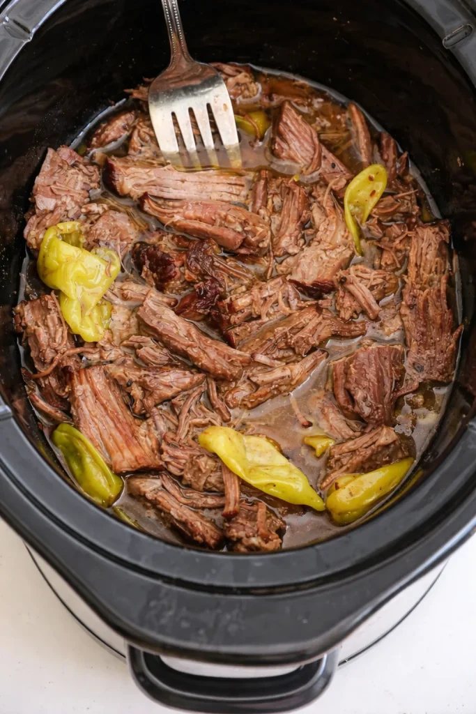 Delicious Mississippi Pot Roast cooked in a crockpot with simple ingredients