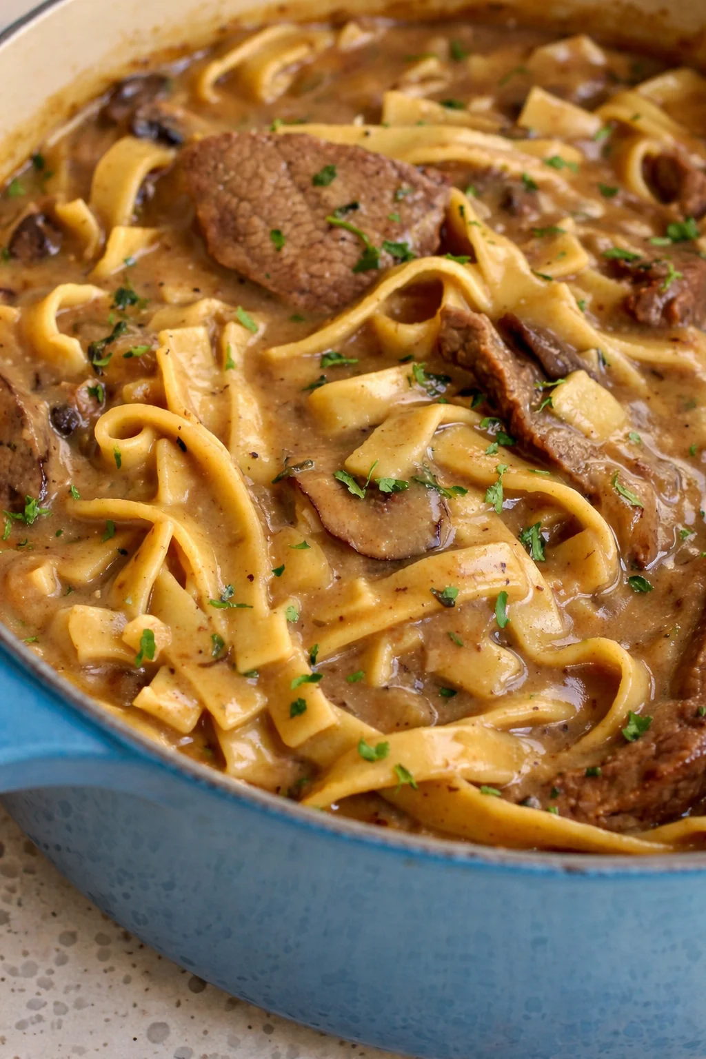 Creamy Beef Stroganoff with tender beef, onions, garlic, and mushrooms.