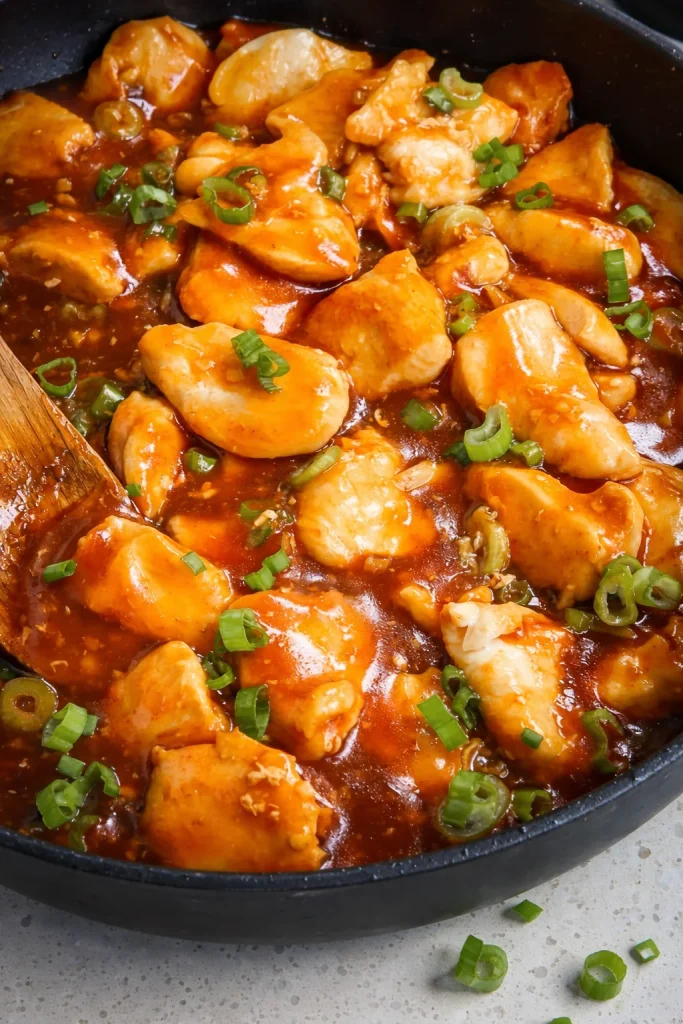 This delicious and easy Bourbon Chicken recipe combines tender golden brown chicken breast bites with sweet and savory sticky bourbon sauce with a hint of spice.