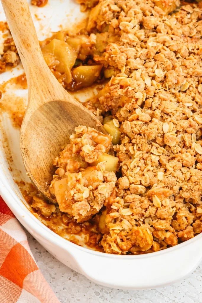 This is a deliciously easy Apple Crumble. Chunks of tart apples are combined with cinnamon and nutmeg, then topped with a crisp brown-sugar-and-cinnamon oat crumb topping.