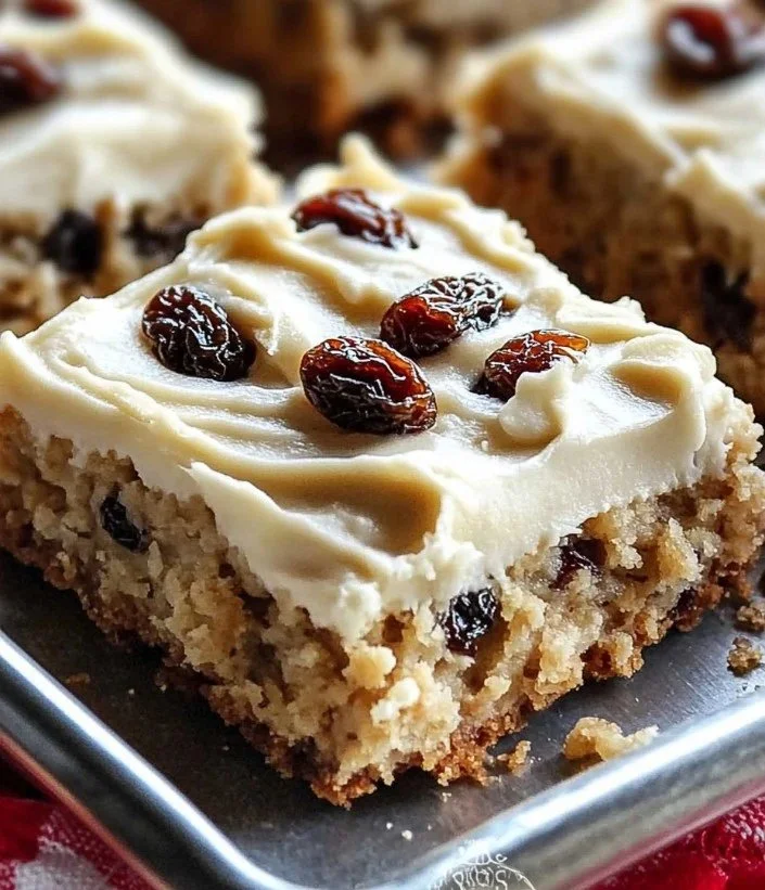 Freshly baked oatmeal raisin cookie bars on a wooden table