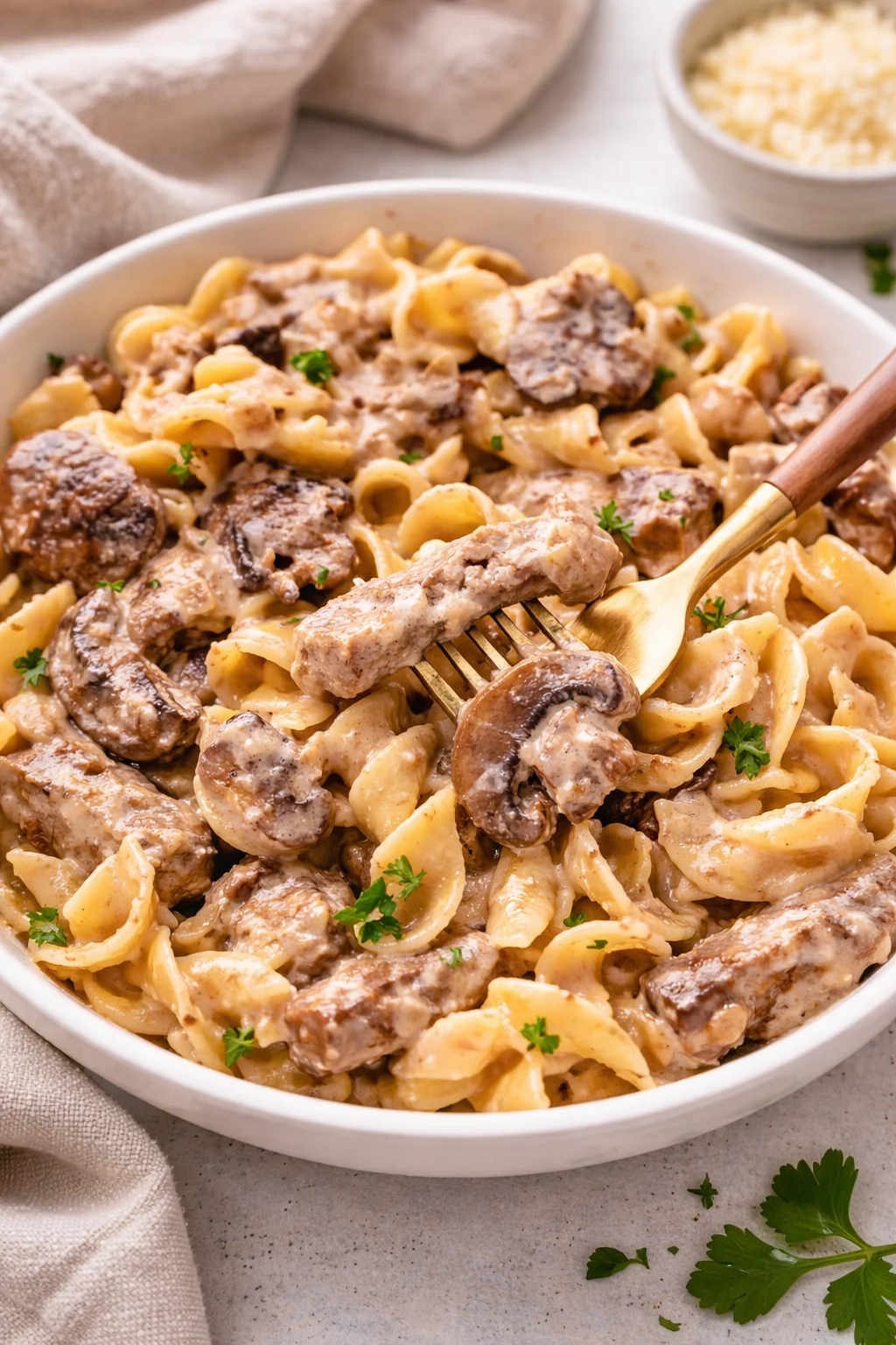 Delicious easy beef stroganoff served with egg noodles and fresh parsley