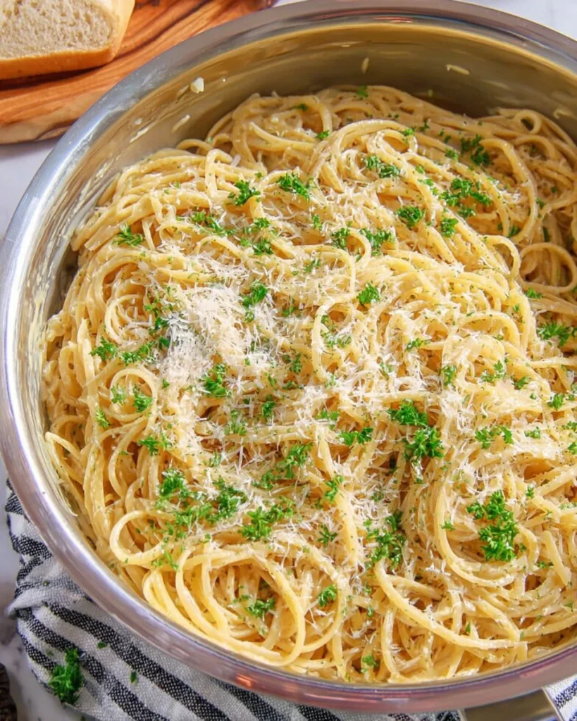 Delicious plate of Garlic Parmesan Pasta with herbs and cheese