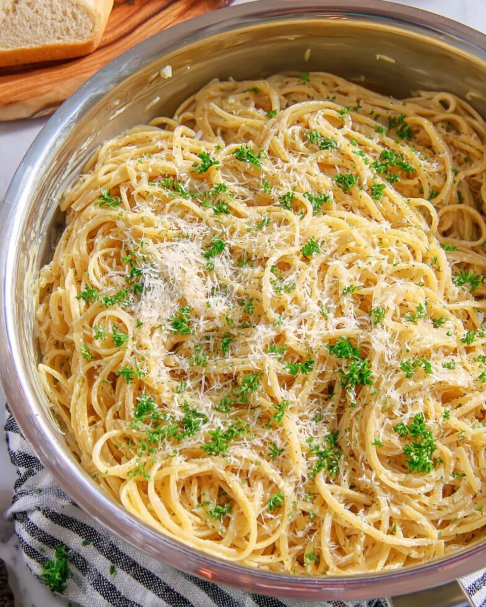 Delicious plate of Garlic Parmesan Pasta with herbs and cheese