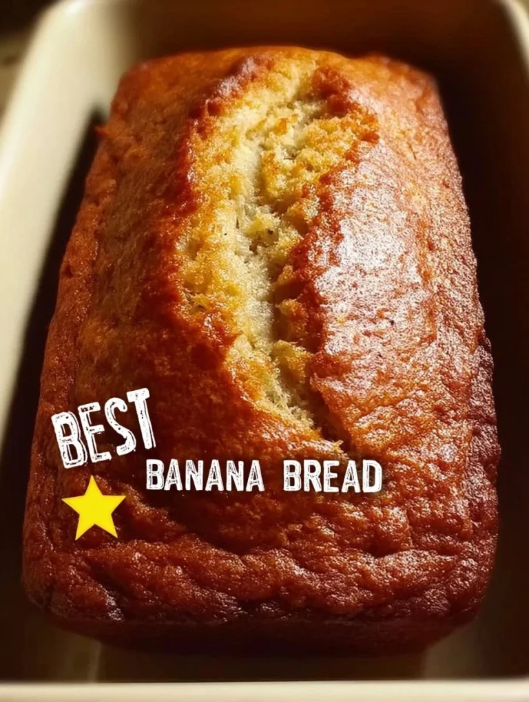 The World’s Best Banana Bread Loaf of freshly baked banana bread with walnuts on a kitchen countertop