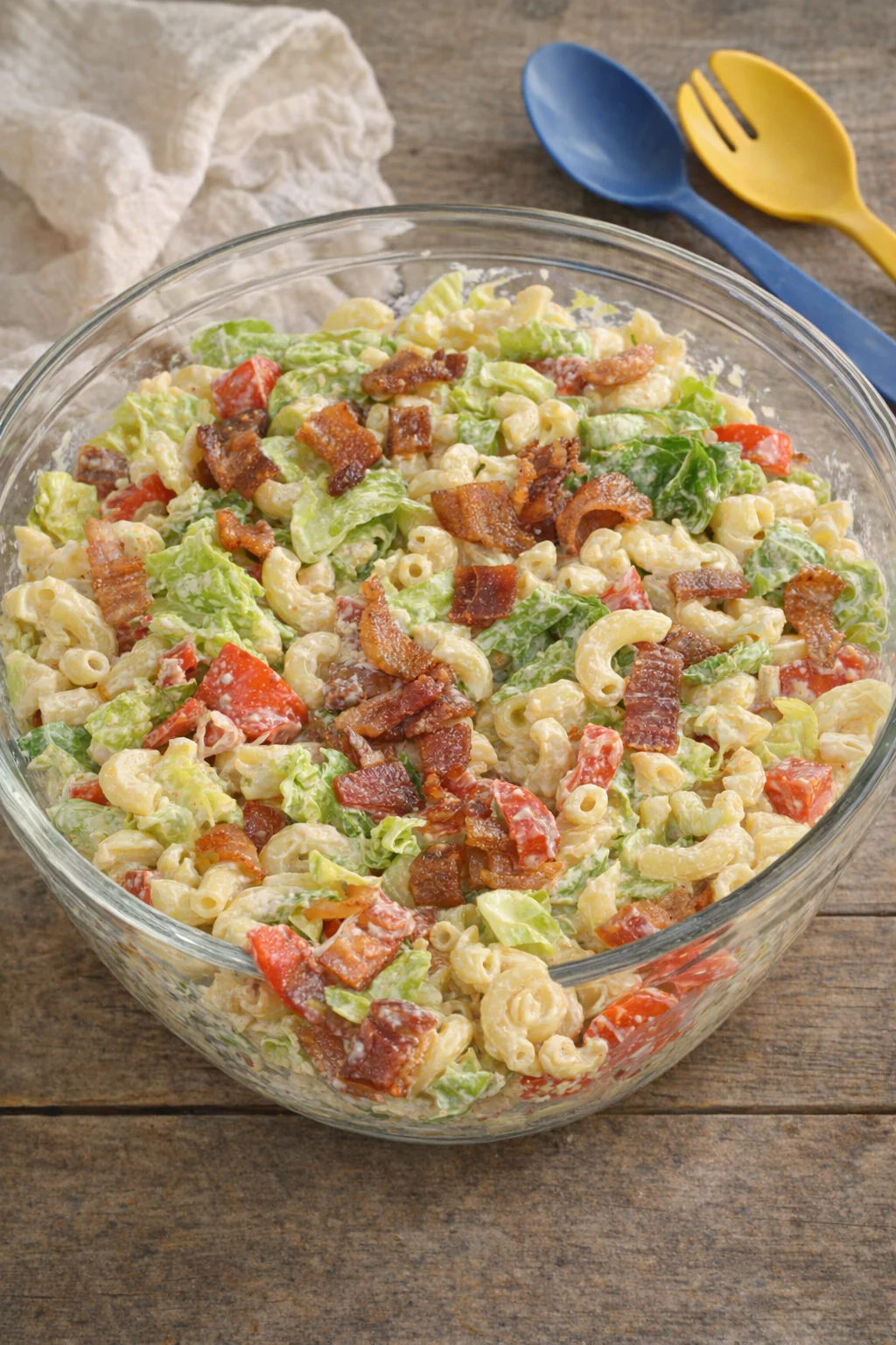 Delicious BLT Pasta Salad with bacon, lettuce, and tomatoes in a creamy dressing.
