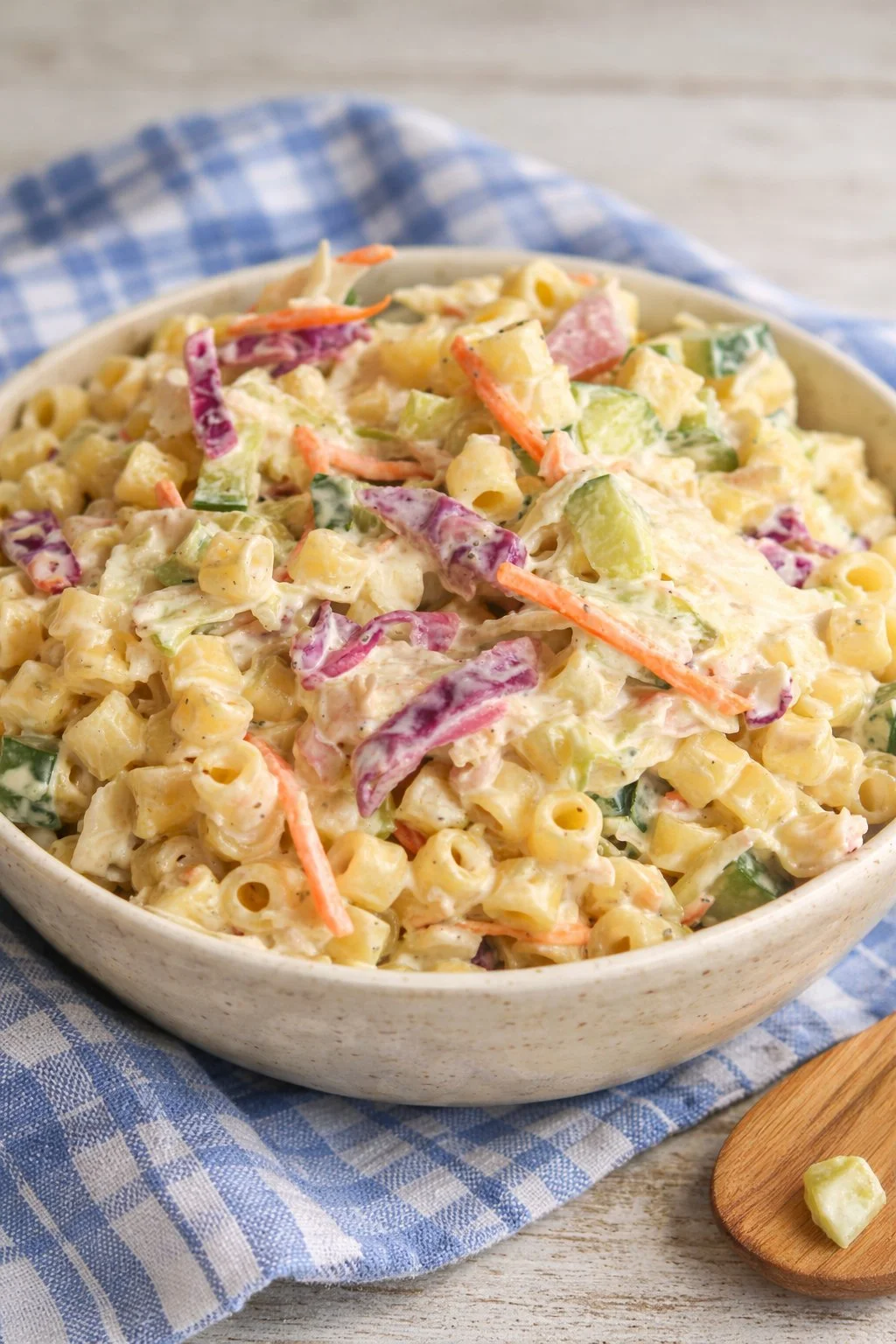 Bowl of coleslaw pasta salad with cabbage, pasta, and vegetables