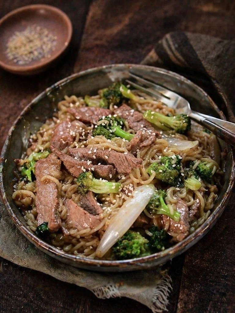 Delicious skillet ramen recipe with beans and broccoli cooked in a pan.