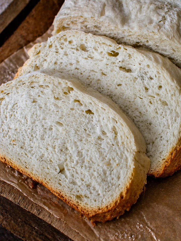 Freshly baked slow cooker bread on a wooden table