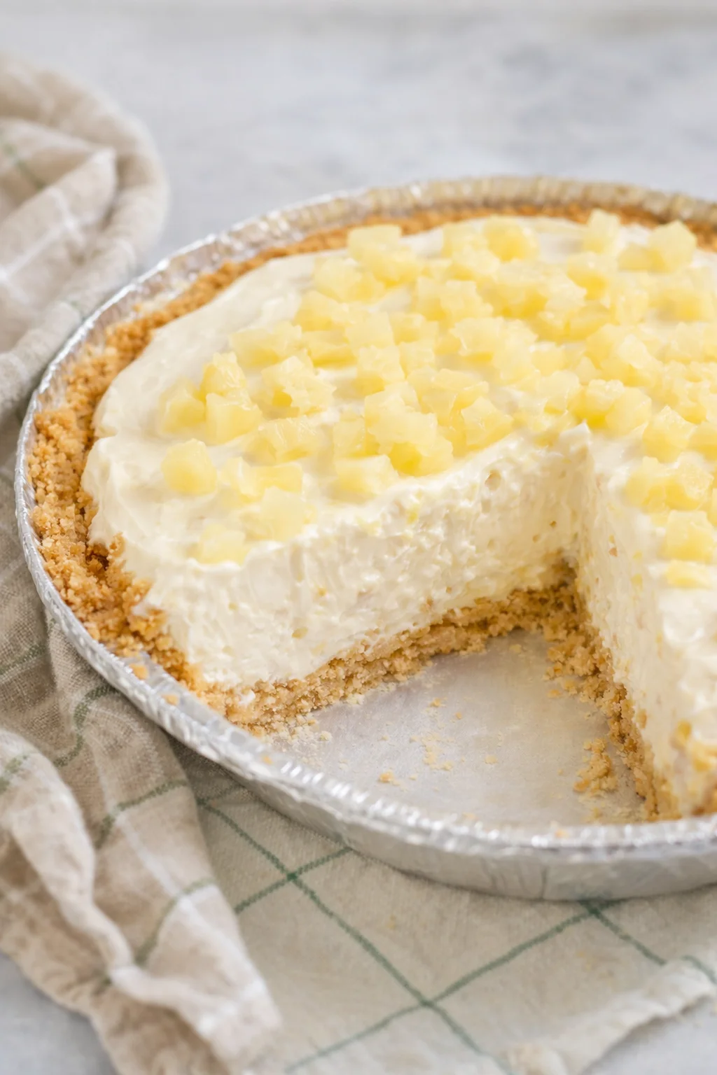 Delicious No Bake Pineapple Cheesecake Pie with tropical decorations