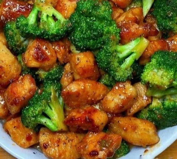 Stir-fried Chicken and Broccoli Stir-fried chicken and broccoli dish on a plate with vibrant colors.