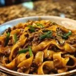 Plate of Mongolian noodles with ground beef and vegetables
