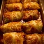 Flavorful stuffed cabbage rolls with meat, rice, and herbs in tomato sauce.