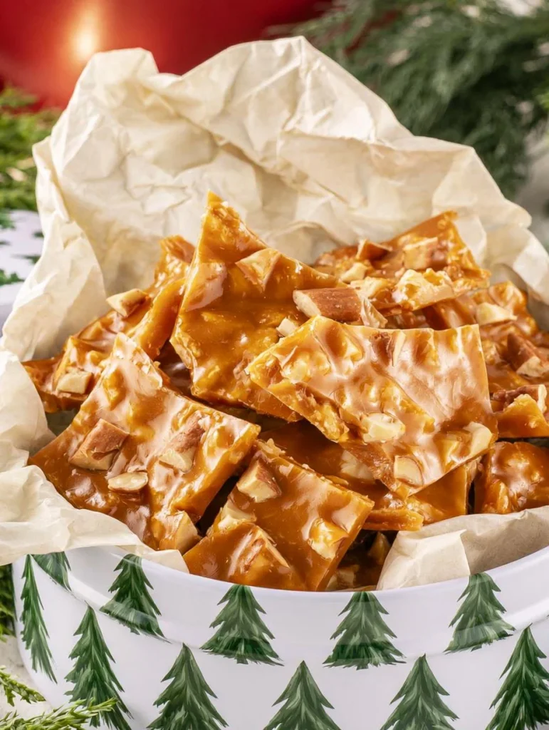 Delicious homemade peanut brittle with crunchy peanuts and a golden caramel texture.
