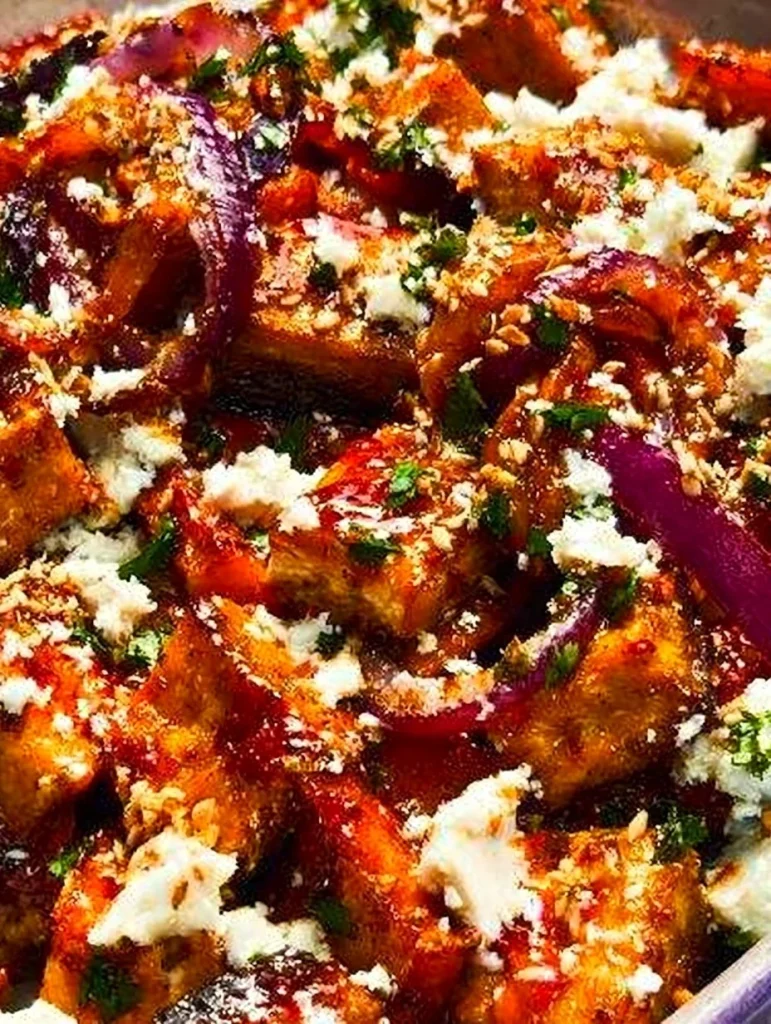 Delicious maple roasted pumpkin with chili and feta cheese garnish