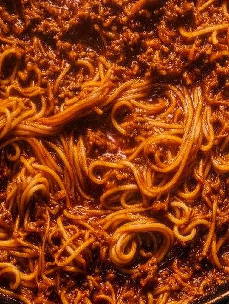 Delicious one pot Pasta Bolognese served with fresh herbs.